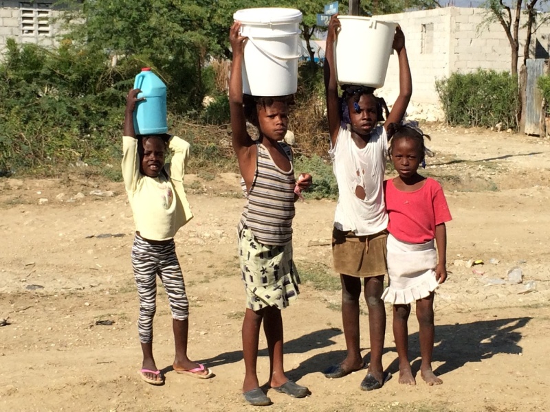 Neighborhood kids fetching water